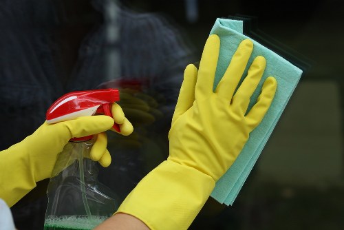 Professional gutter cleaning on a Putney house with debris removal