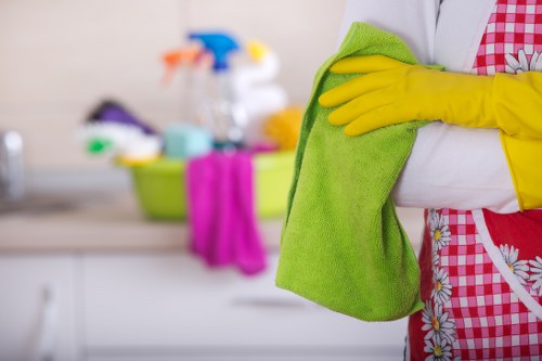 Local cleaner working in a Putney flat with careful attention to detail
